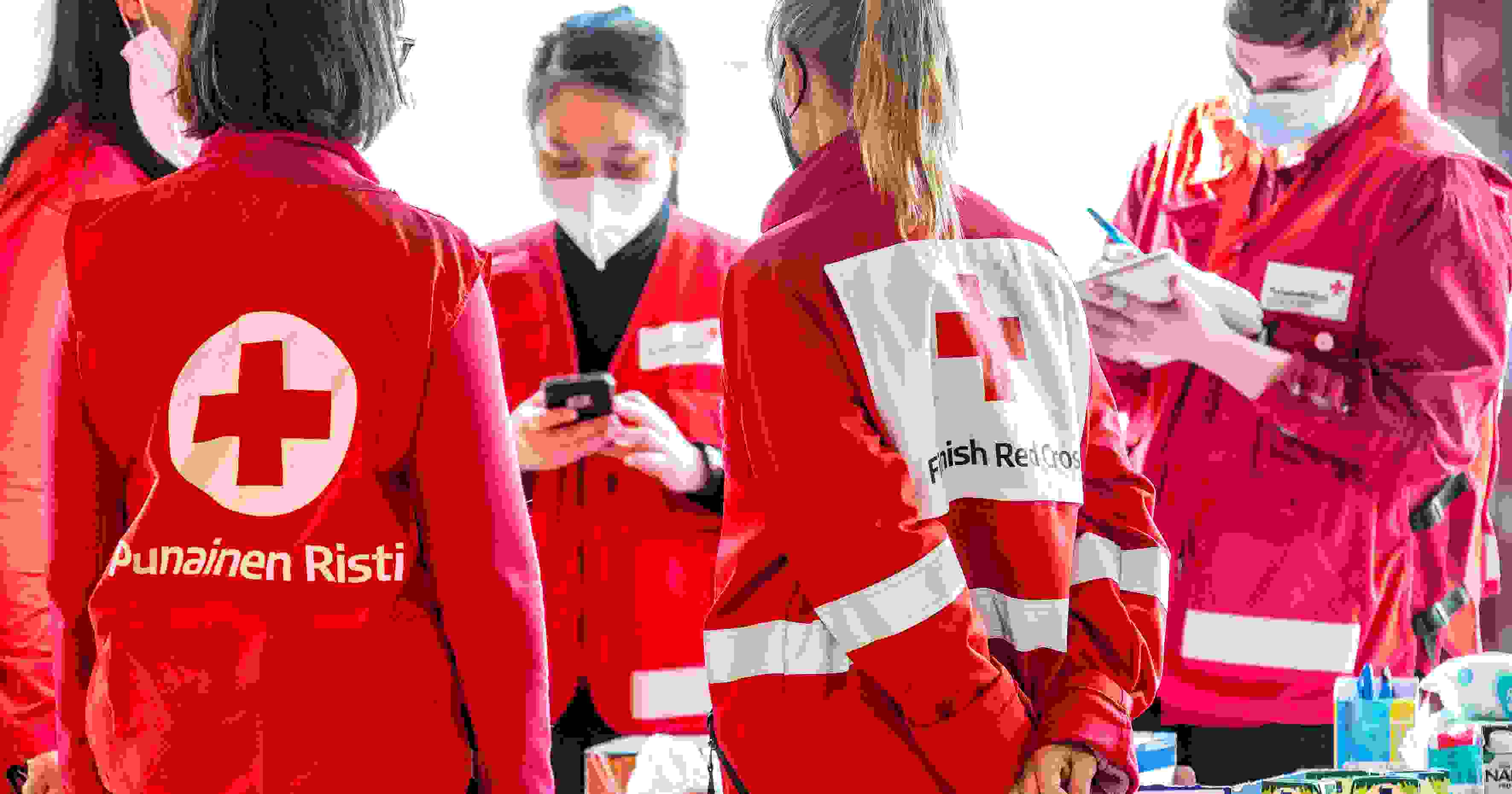 People wearing Red Cross clothing at West Harbour.