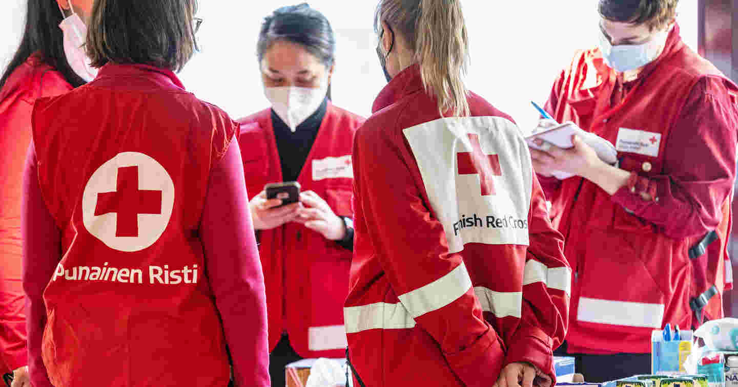 People wearing Red Cross clothing at West Harbour.