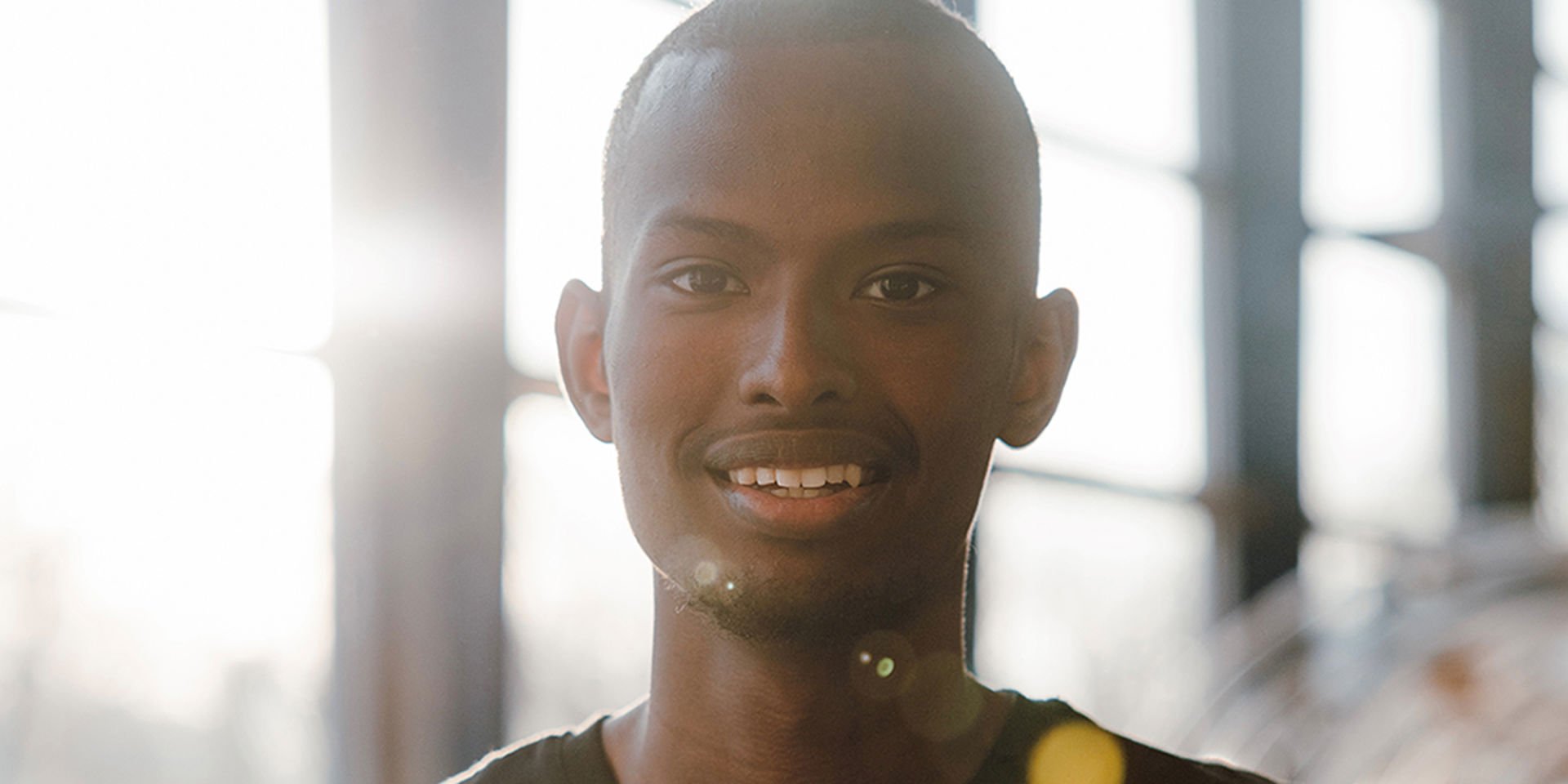 Mustafe Muuse smiles at the camera.