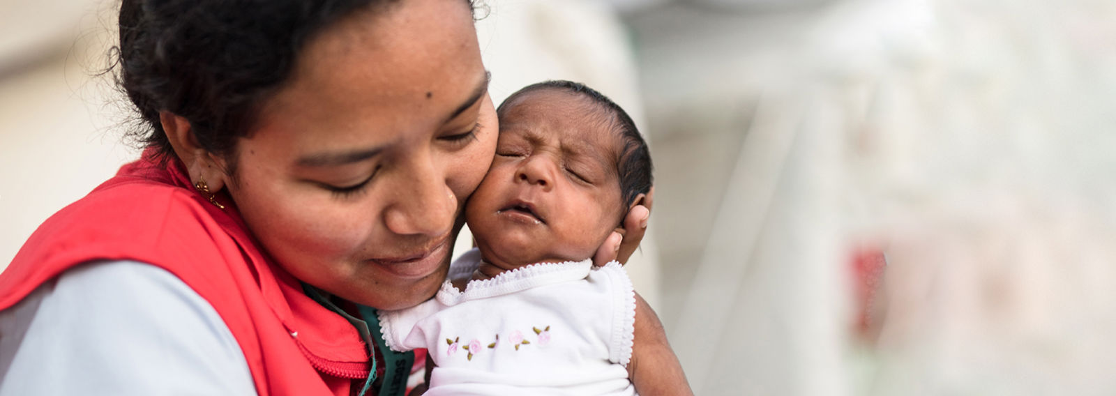 Smiling Nepalese children wearing school uniforms on their way to school.