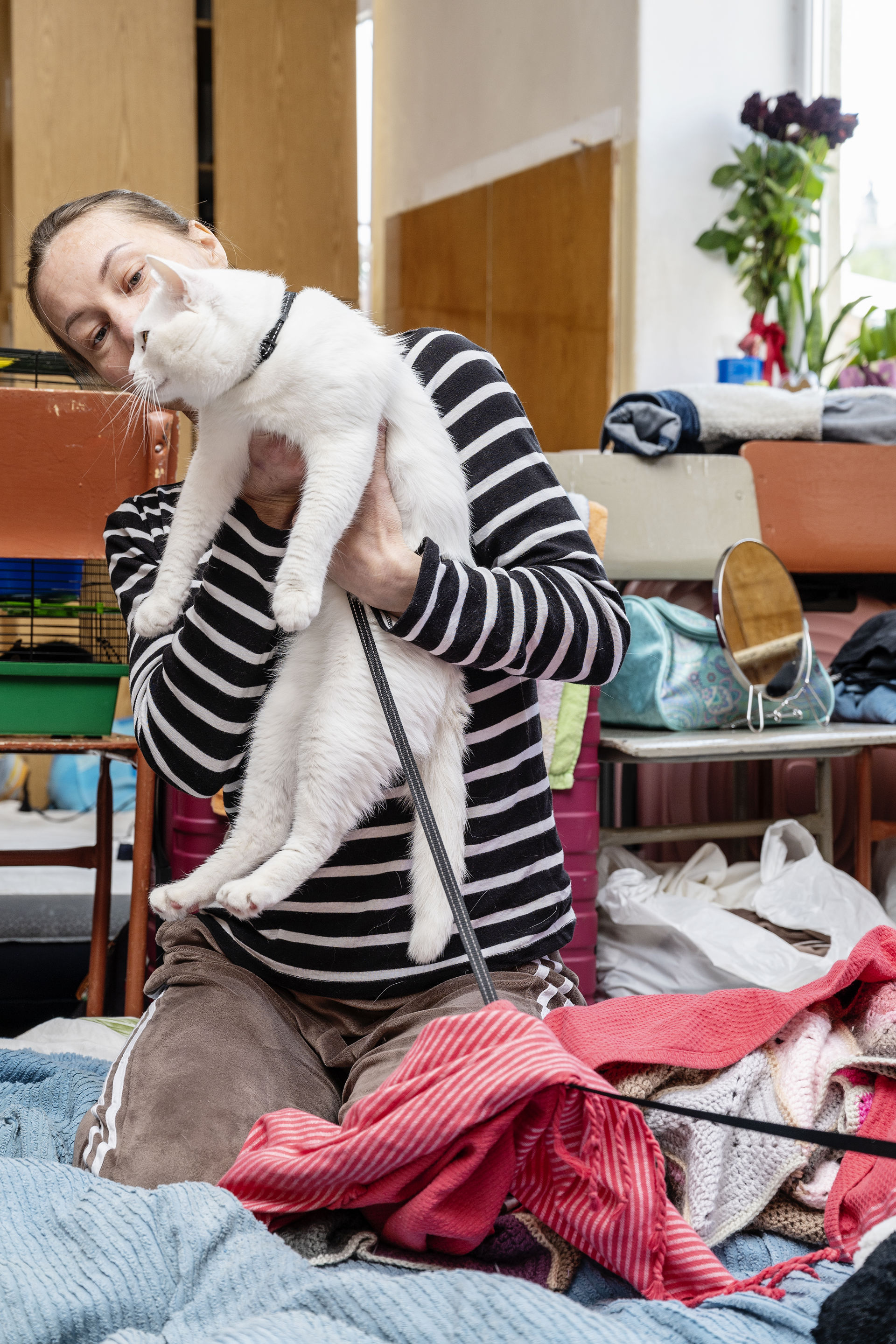A woman holding a cat.