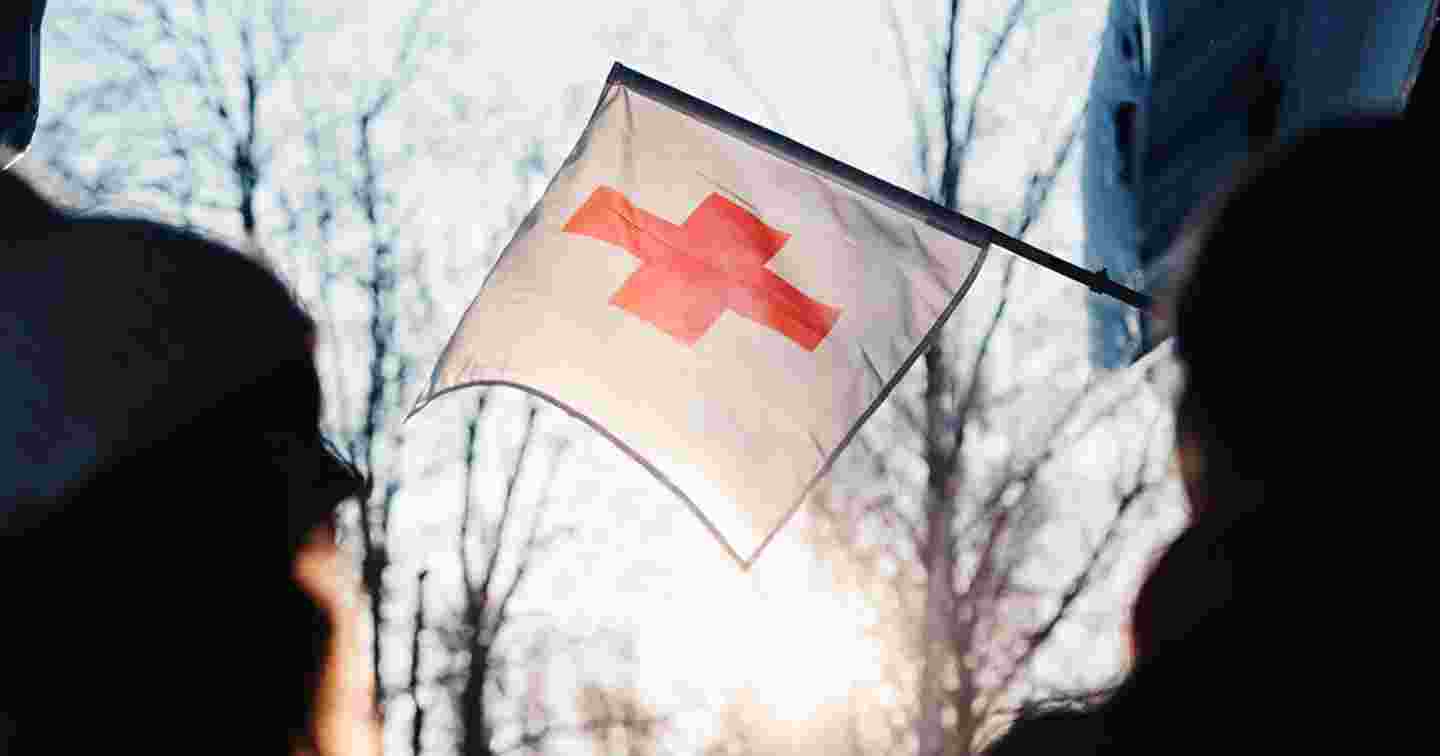 The Red Cross flag in front of a Youth Shelter.